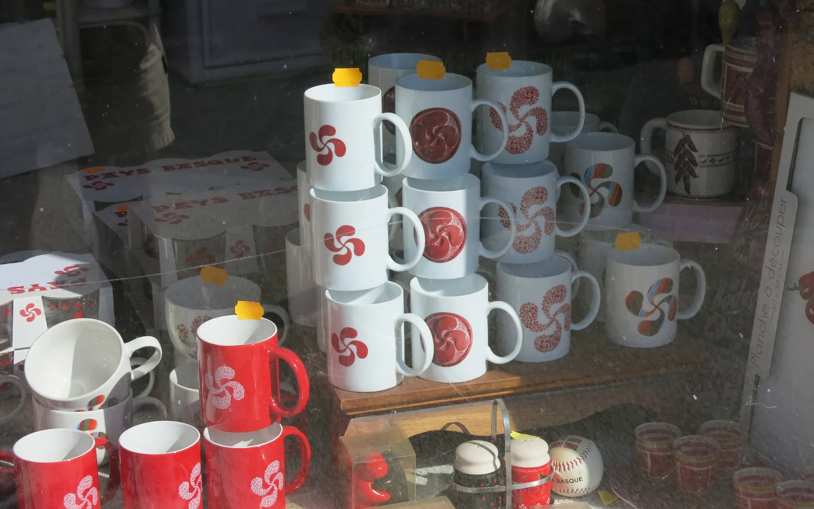 Ceramic mugs decorated with the traditional Basque lauburu cross symbol